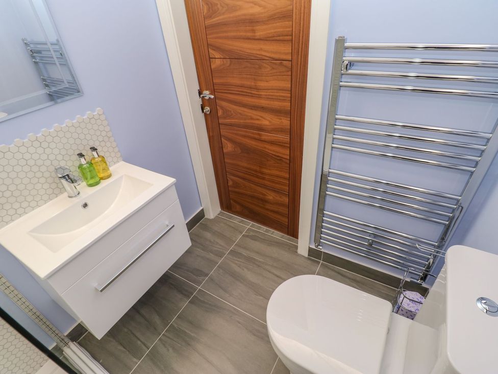 A bathroom with sink and toilet at Stackyard in Durham