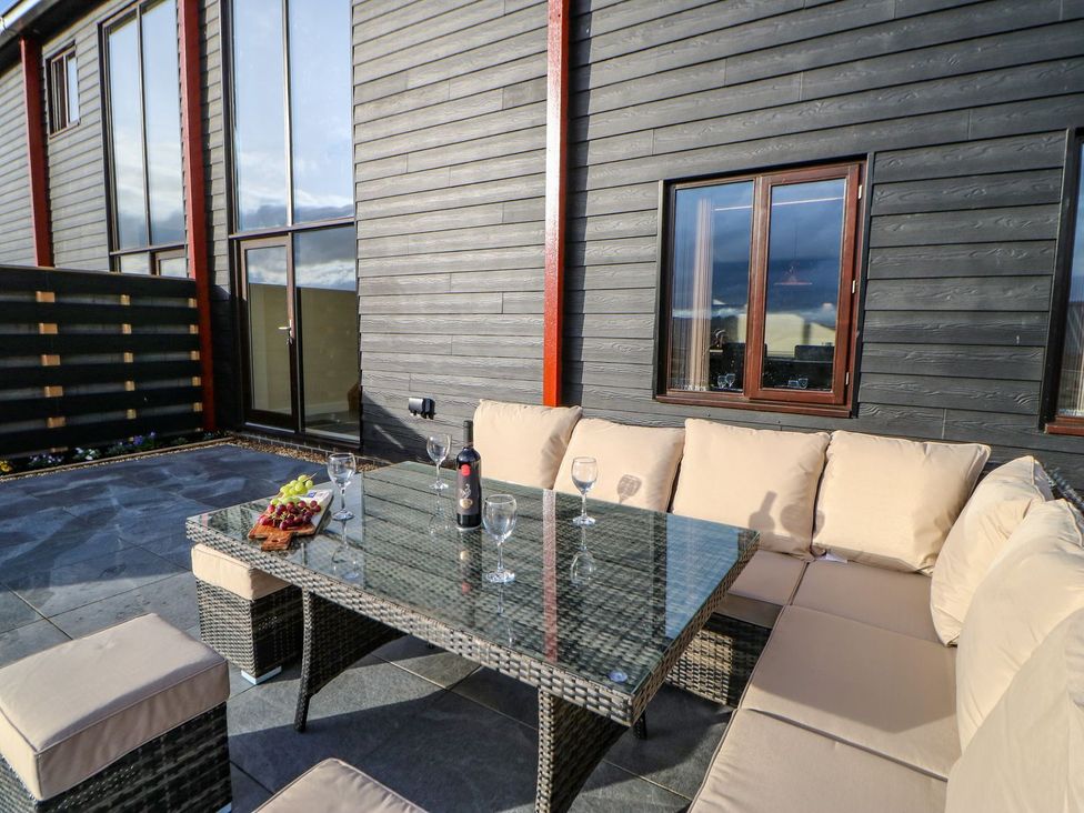 An outdoor dining area with seating and a table at Stackyard in Durham