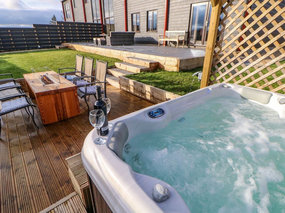 An outdoor area with a hot tub and seating at Stackyard in Durham