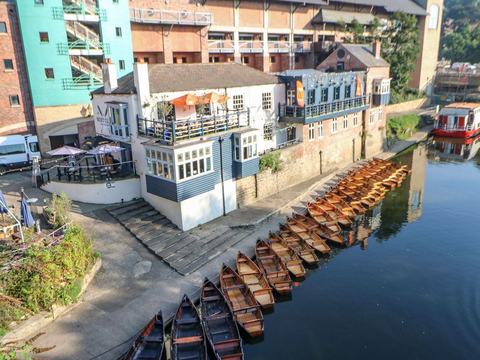 An outdoor area with boats by the water at Stackyard in Durham