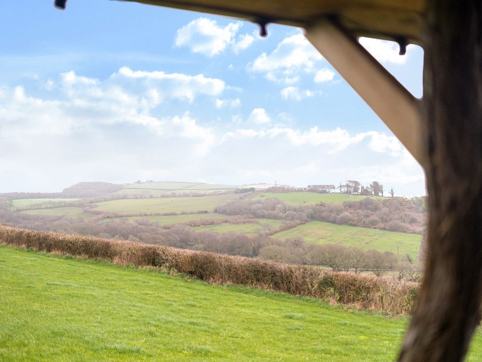 A view of hills and grass from an outdoor location at The Retreat Cabin in Llanelli