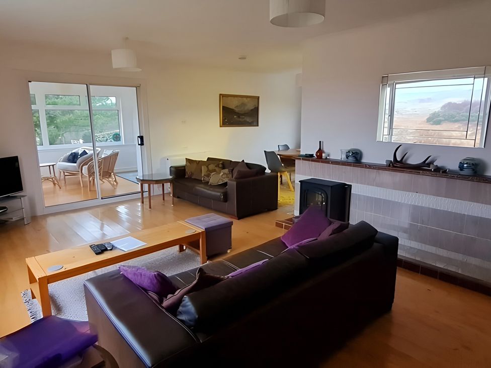 A living room with sofa and television at Erisgeir in Isle of Mull