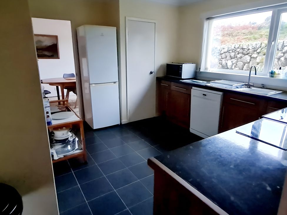 A kitchen with appliances and countertop at Erisgeir Isle of Mull