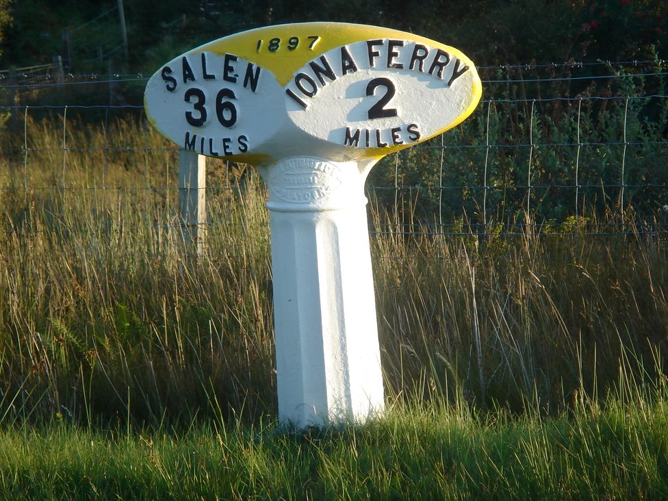 A distance sign indicating Salen 36 miles and Iona Ferry 2 miles at Erisgeir Isle of Mull