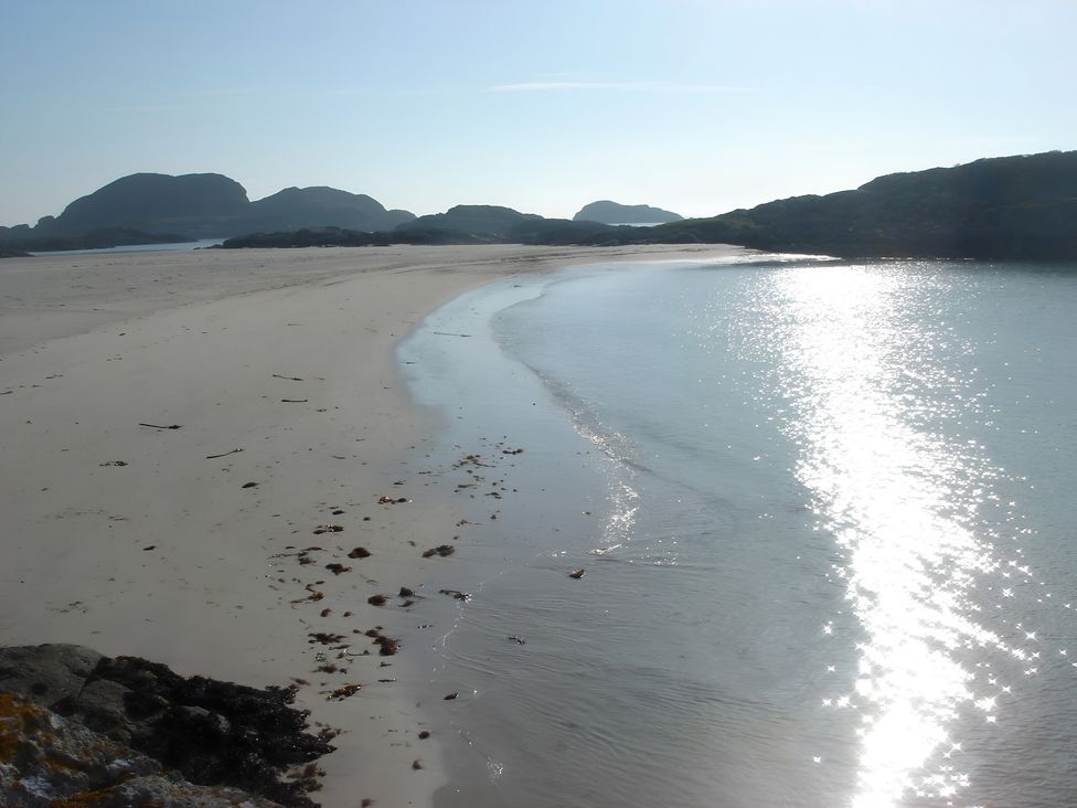 A beach with sand and water at Erisgeir on Isle of Mull