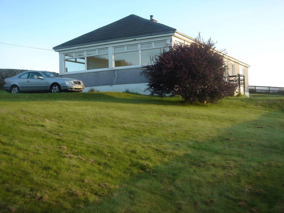 A house with a car parked outside at Erisgeir in Isle of Mull