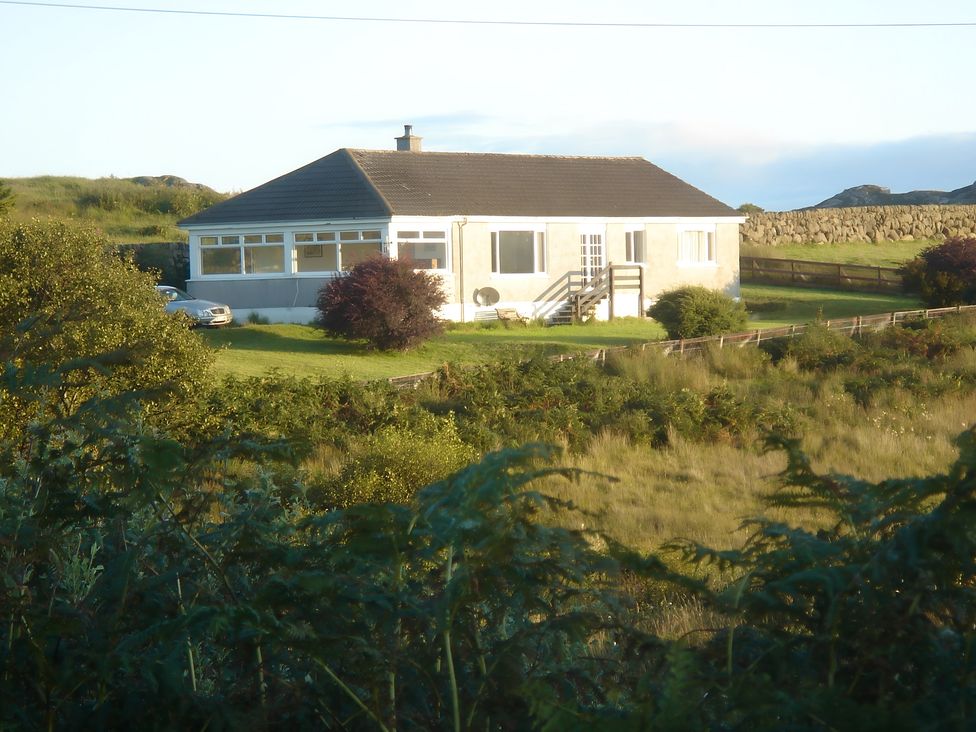 A house with windows and a garden at Erisgeir Isle of Mull