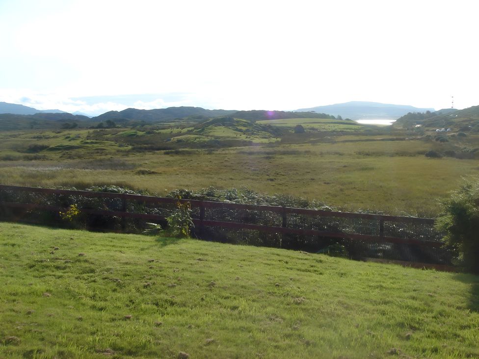 A landscape view with hills and fence at Erisgeir, Isle of Mull
