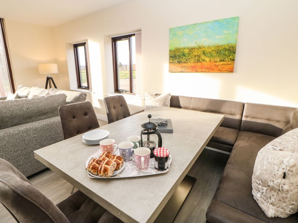 A dining room with a table and coffee cups at High Church Hill in Durham