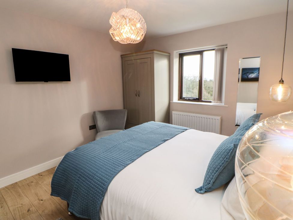 A bedroom with a bed and television at High Church Hill in Durham