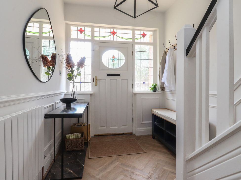 A hallway with a console table and mirror at 11 Sandhurst Avenue Lytham St. Annes
