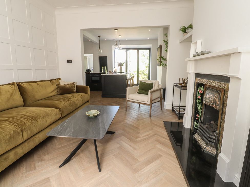 A living room with a sofa and coffee table at 11 Sandhurst Avenue Lytham St. Annes