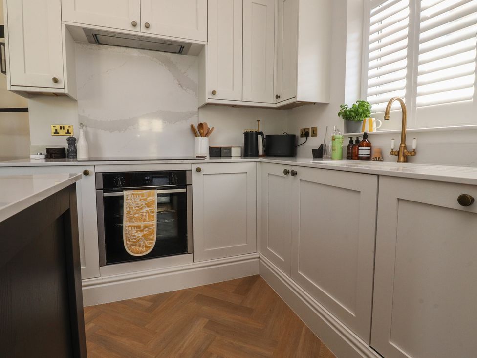 A kitchen with cabinets, an oven, and countertop items at 11 Sandhurst Avenue Lytham St. Annes