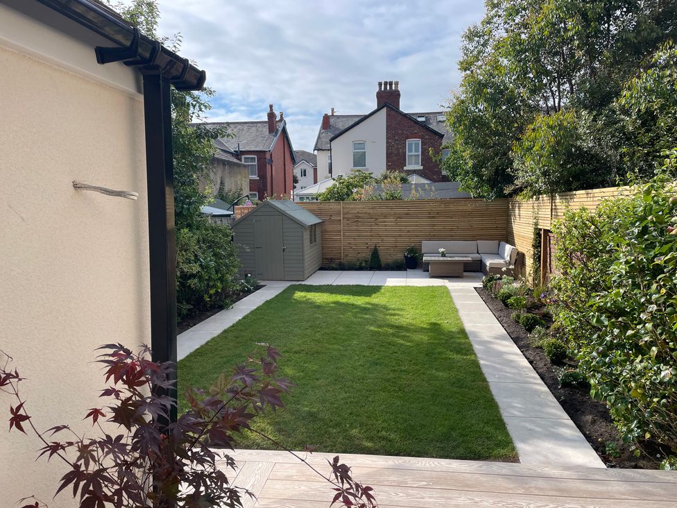 A garden with grass and furniture at 11 Sandhurst Avenue Lytham St. Annes