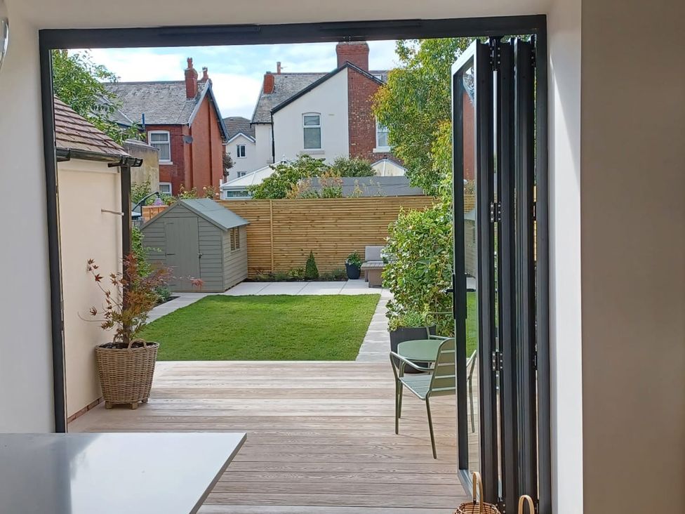An outdoor view of a garden with a shed and seating area at 11 Sandhurst Avenue Lytham St. Annes