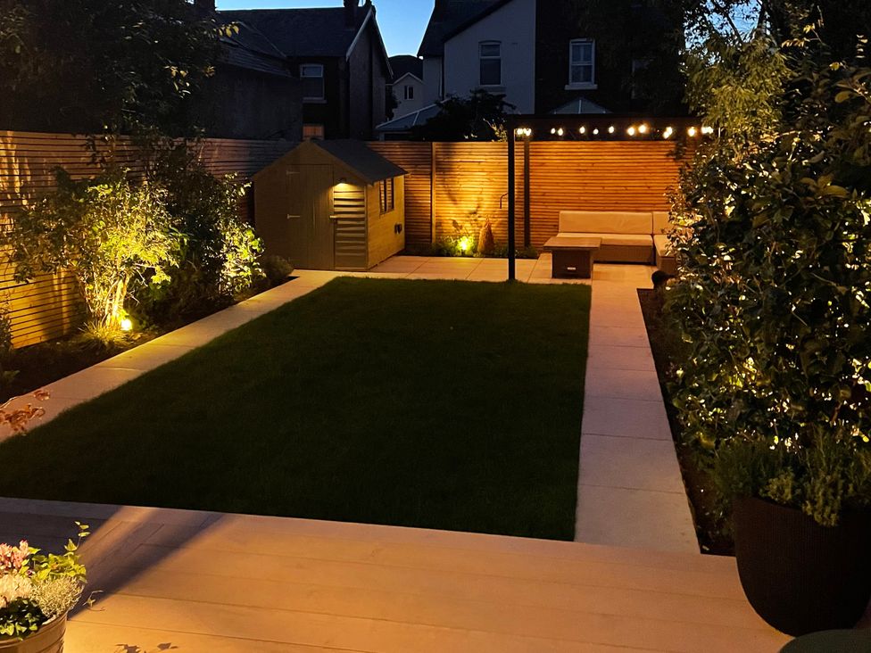 A garden with grass and a shelter at 11 Sandhurst Avenue, Lytham St. Annes