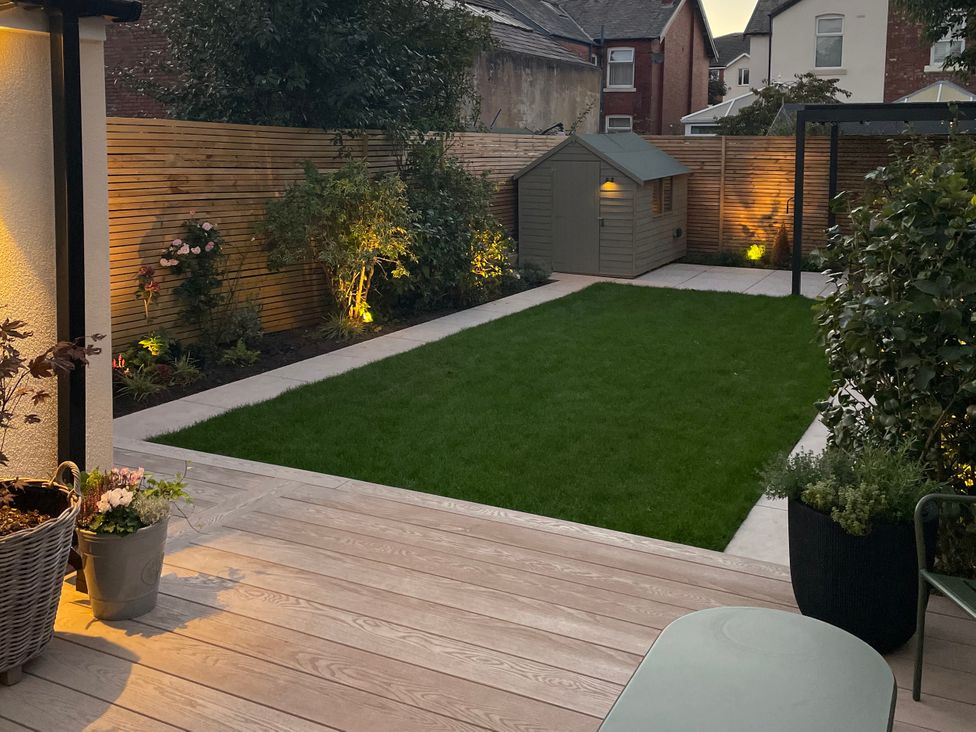 A garden with grass, shed, and planters at 11 Sandhurst Avenue, Lytham St. Annes