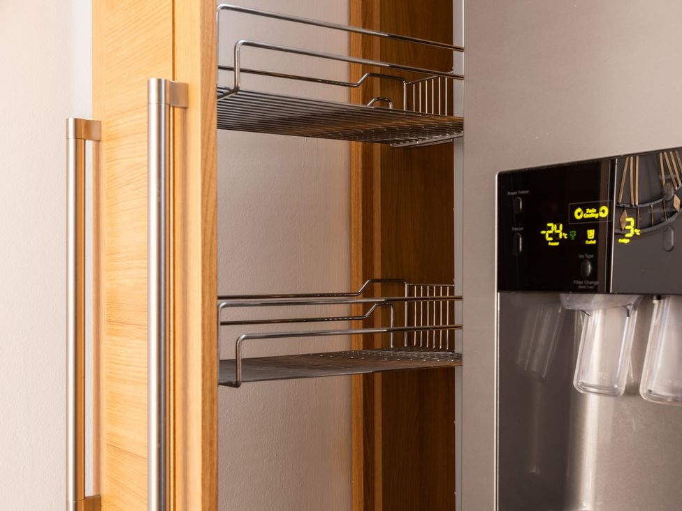 A refrigerator with shelves and water dispenser at 11A Cards Wynd Anstruther