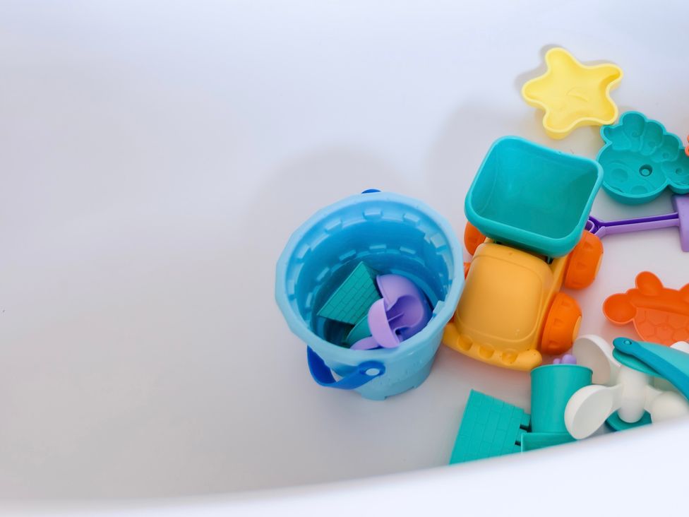 A collection of toy items in a bathtub at 11A Cards Wynd Anstruther