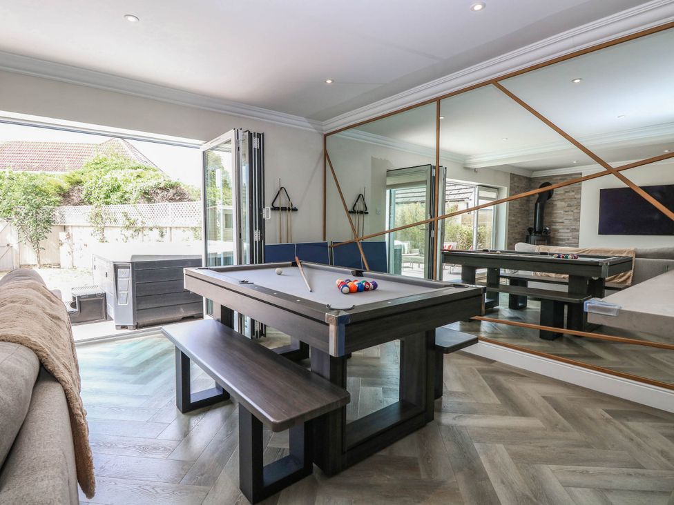 A games room with a pool table and outdoor area at Cootiya Corner in Great Lyth
