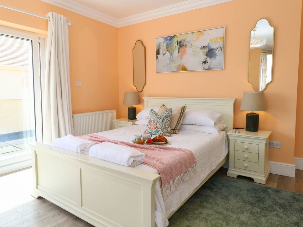 A bedroom with a bed and nightstands at Cootiya Corner in Great Lyth