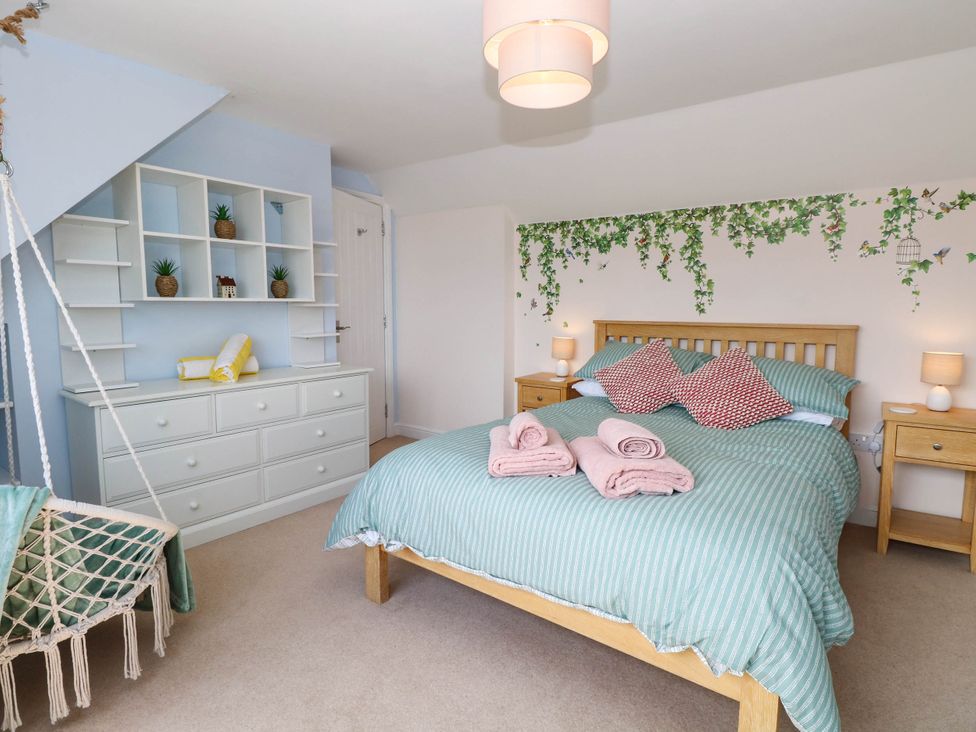 A bedroom with a bed and storage furniture at Cootiya Corner in Great Lyth
