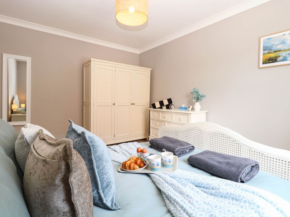 A bedroom with a bed and wardrobe at Cootiya Corner in Great Lyth