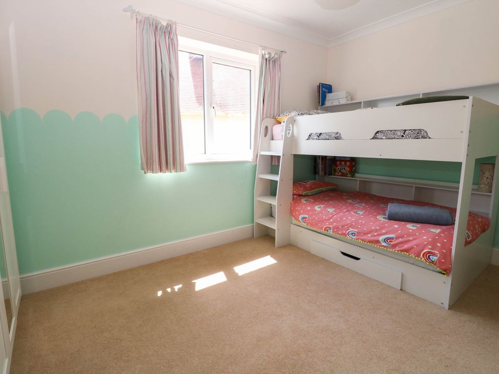 A bedroom with a bunk bed and window at Cootiya Corner Great Lyth