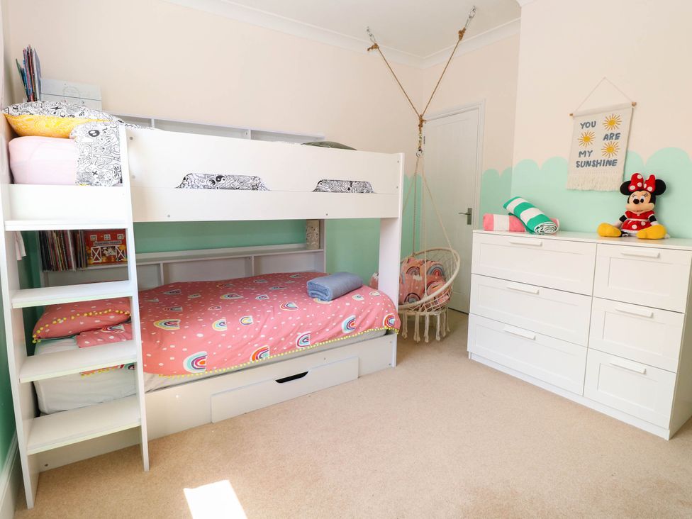 A bedroom with a bunk bed and dressers at Cootiya Corner in Great Lyth