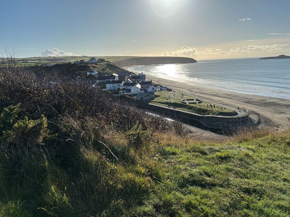 A beach with houses nearby and a pathway at Seren Fach near Aberdaron