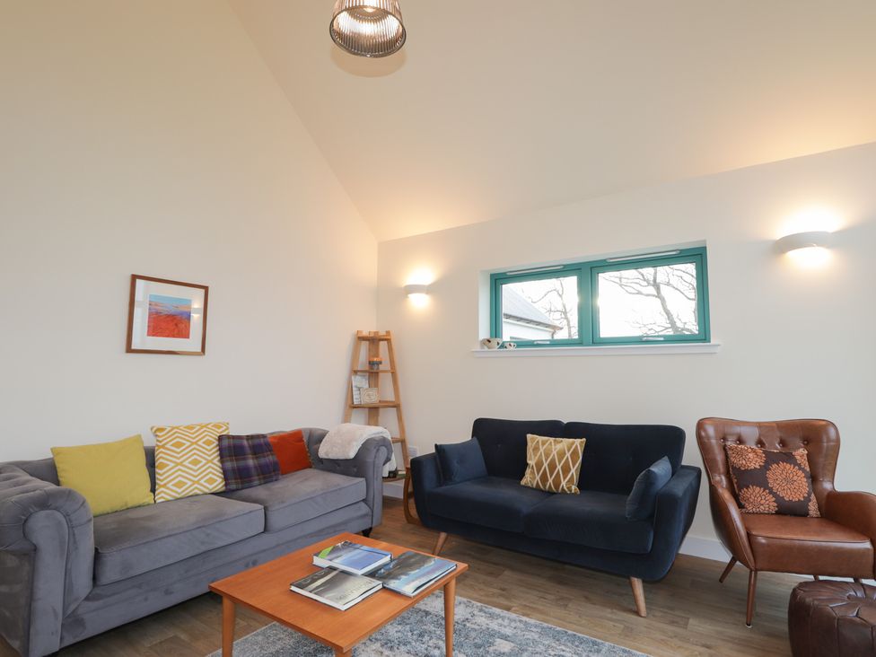 A living room with sofas and a coffee table at Sonas in Strathcarron
