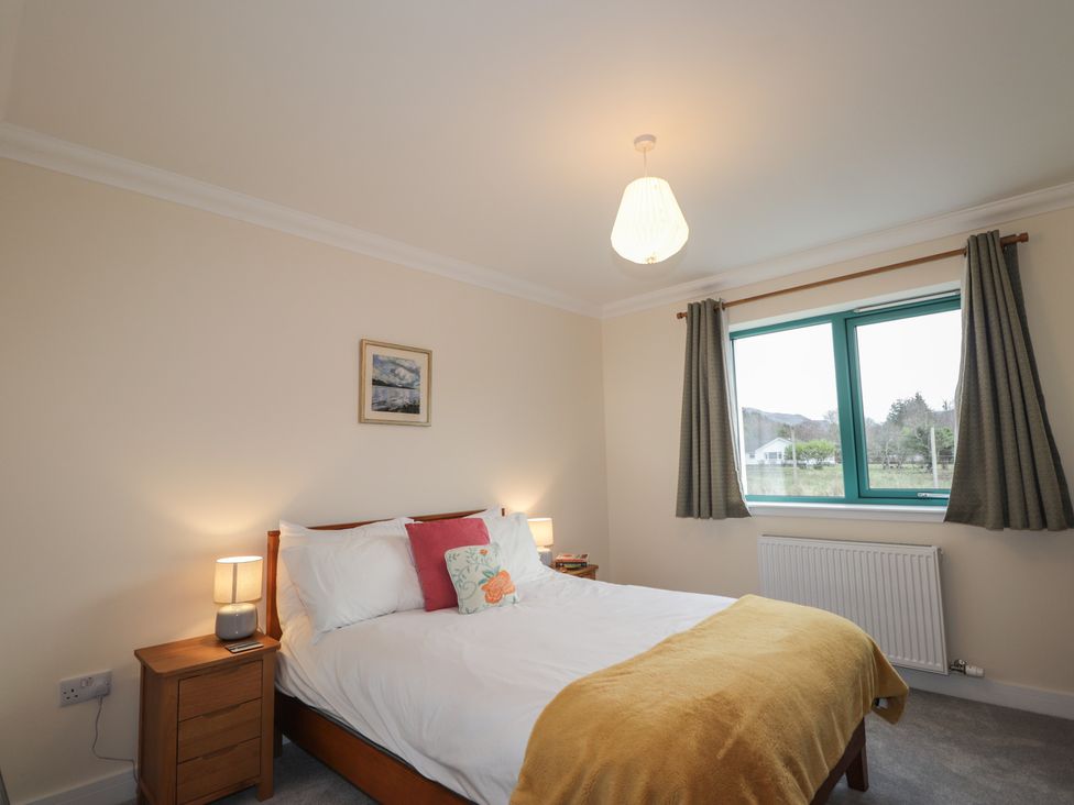 A bedroom with a bed and window at Sonas in Strathcarron
