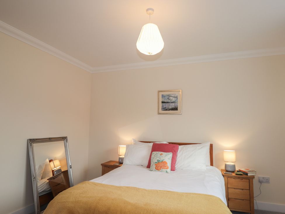 A bedroom with a bed and lamps at Sonas in Strathcarron