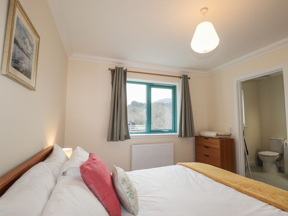 A bedroom with a bed and window at Sonas in Strathcarron