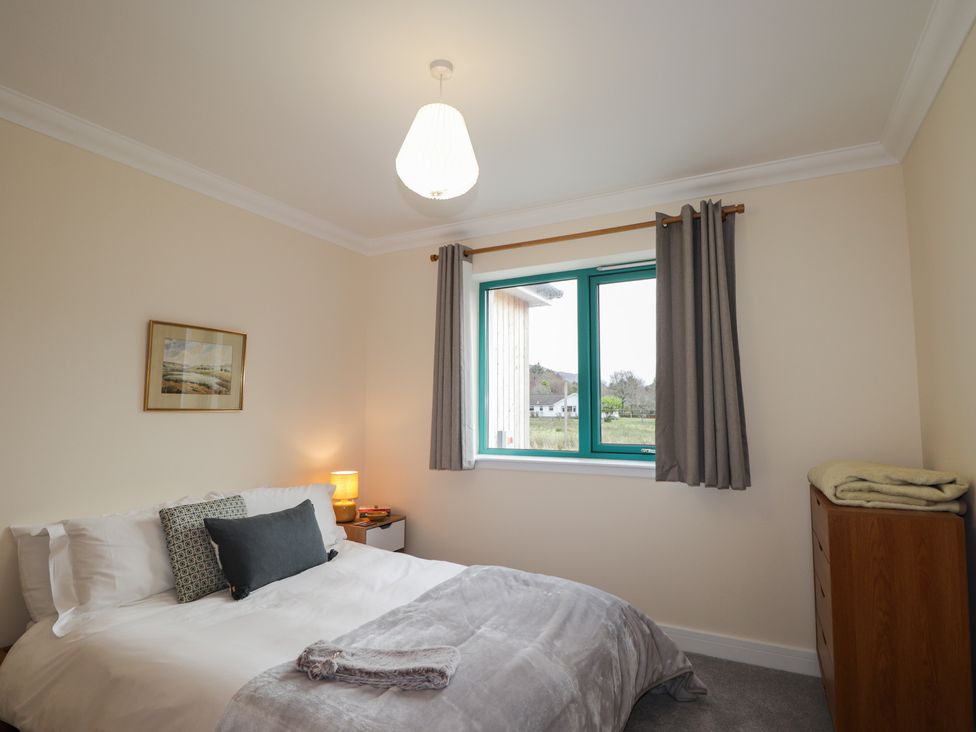 A bedroom with a bed and window at Sonas in Strathcarron