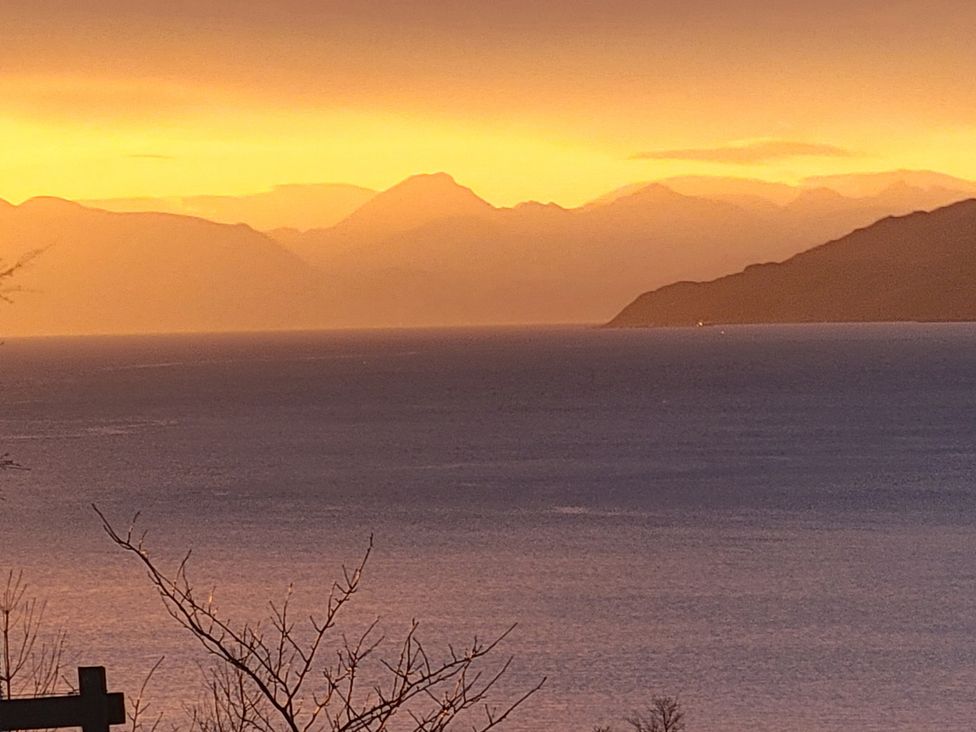 A view of mountains and water during sunset at Sonas in Lochcarron