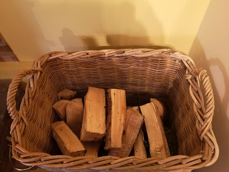 A basket filled with firewood at Claymires Stirling