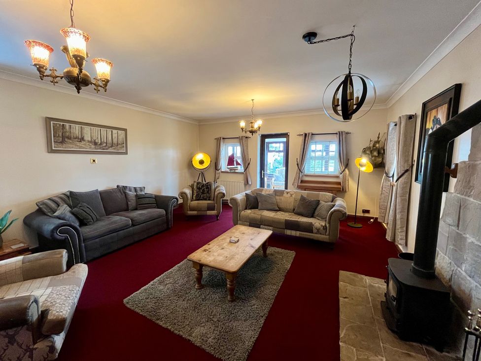 A living room with a sofa and coffee table at Starshinezzz in Trimdon Station