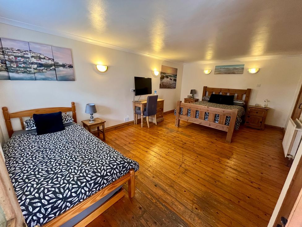 A bedroom with two beds and a desk at Starshinezzz Trimdon Station