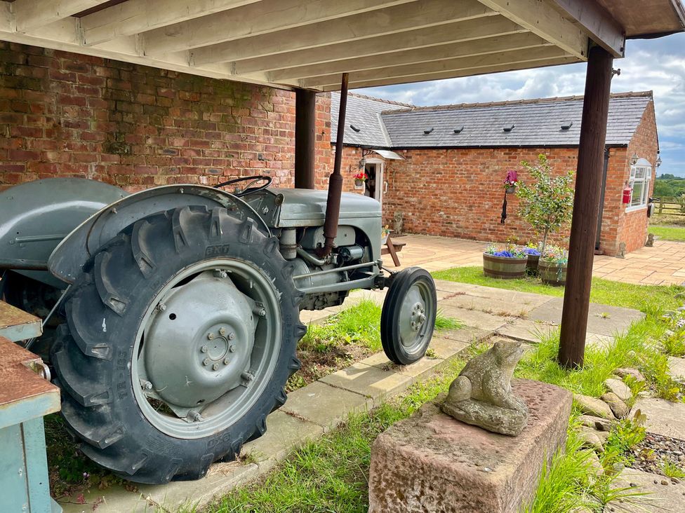 A tractor under a structure at Starshinezzz in Trimdon Station