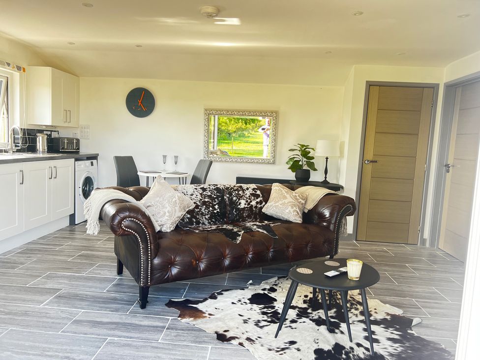 A living room with a couch and coffee table at The lodge at Plumstone View Haverfordwest
