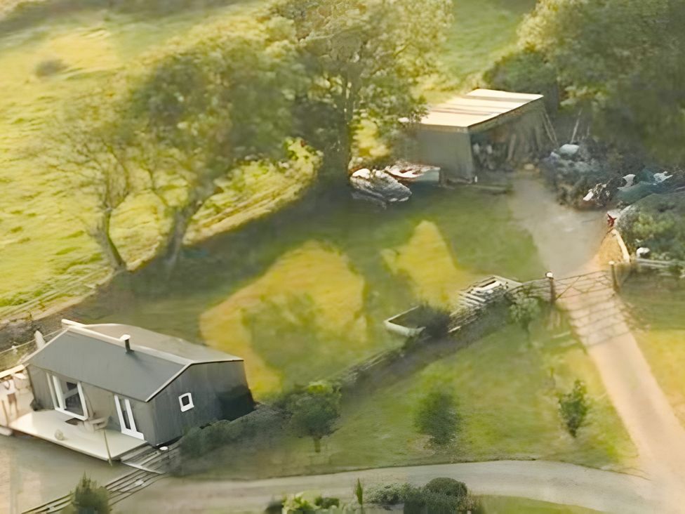 A yard with a building and shed at The lodge at Plumstone View in Haverfordwest