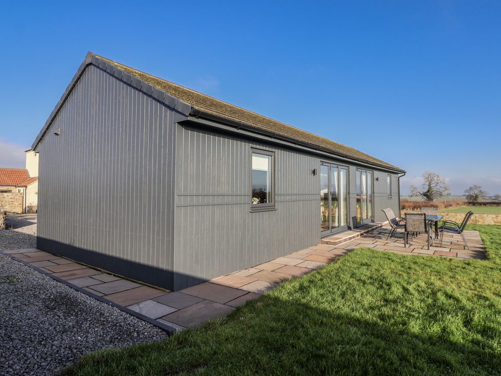 A house with a patio and furniture at Fleetwood in Richmond