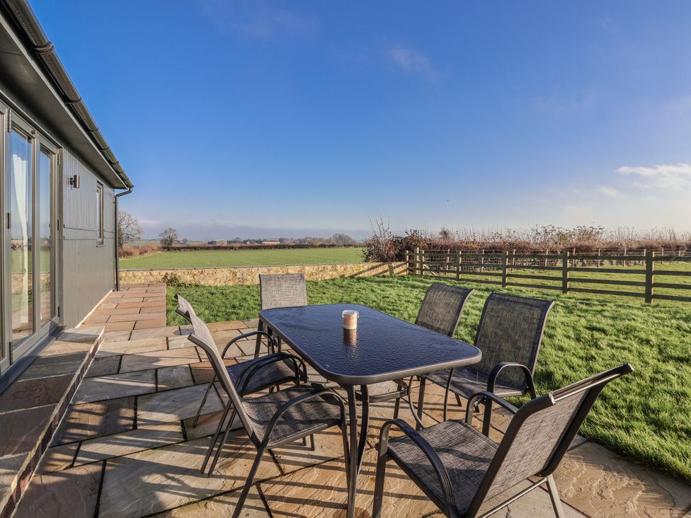 An outdoor area with a table and chairs at Fleetwood in Richmond
