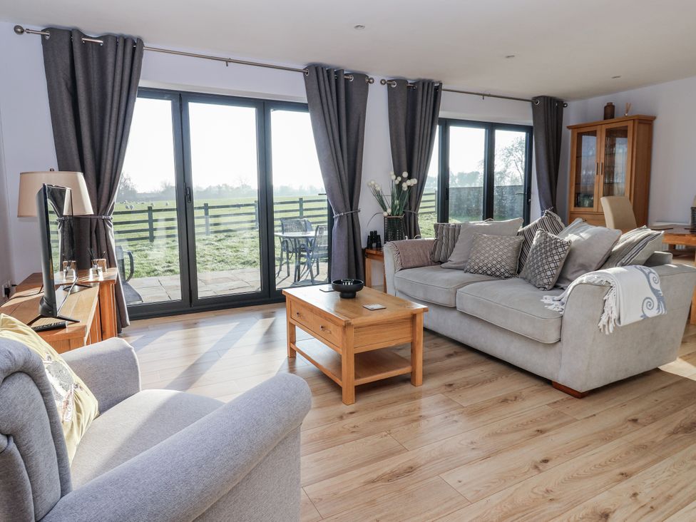 A living room with a sofa and television at Fleetwood in Richmond