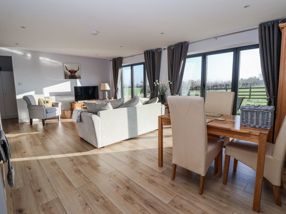 A living room with a sofa and table at Fleetwood in Richmond