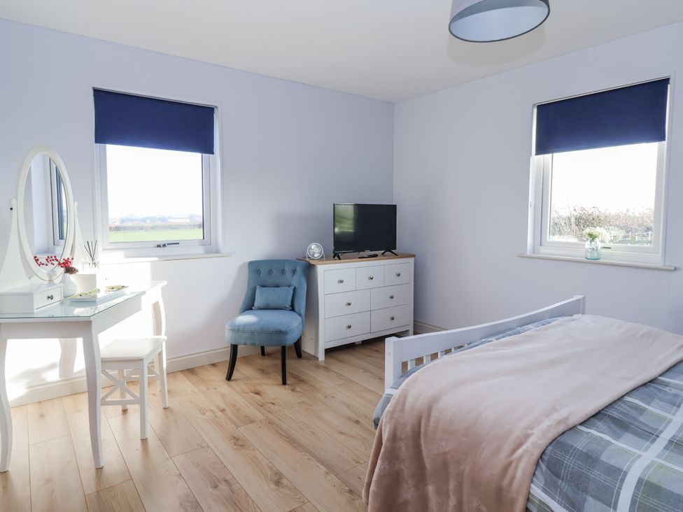 A bedroom with a bed and a dresser at Fleetwood in Richmond