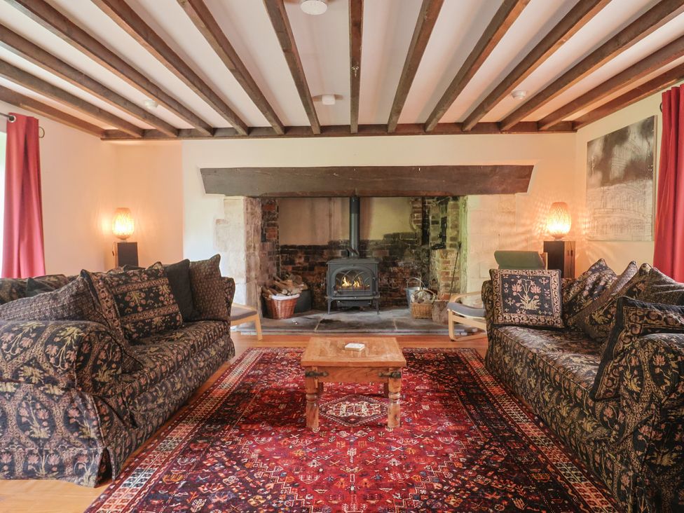 A living room with two sofas and a coffee table at Ellishayes Farm in Combe Raleigh