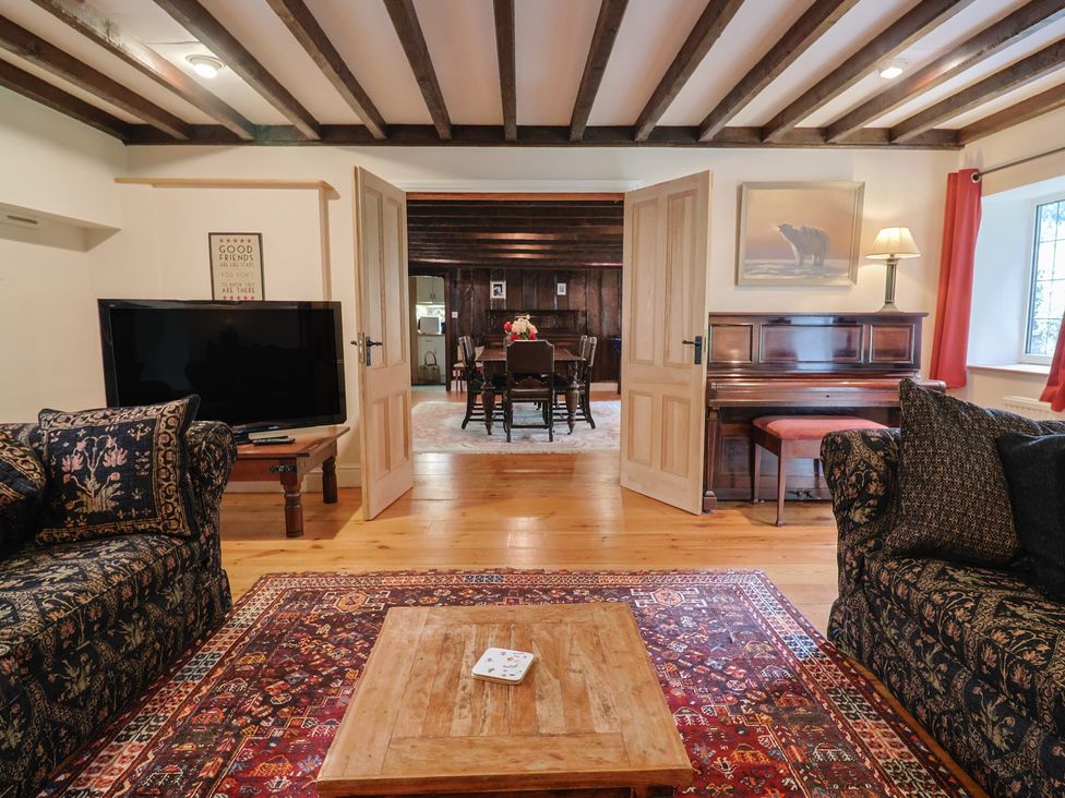 A living room with a sofa and coffee table at Ellishayes Farm in Combe Raleigh