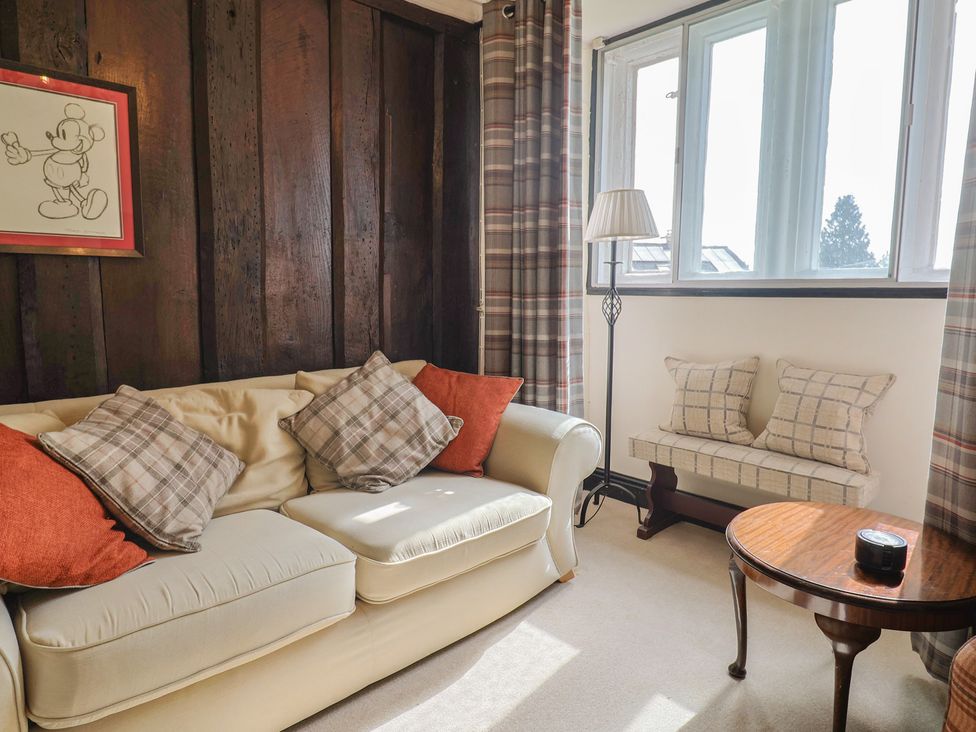 A living room with a sofa and side table at Ellishayes Farm in Combe Raleigh